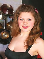 Full girl takes her little black dress off on cam