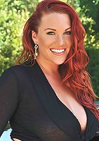 Gorgeous redhead drives in sportcar