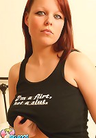 Redheaded schoolgirl gets horny showing off her big boobs for you