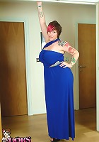 Busty Dors squeezes tits into tight blue dress and plays with pussy