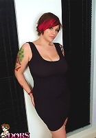 Tattooed British alt girl Dors in tight black dress plays with her pussy