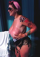 Amateur big tit babe Dors Feline rubs lotion into her huge tits