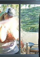 Kelly cleans her windows and gets her white shirt all wet!