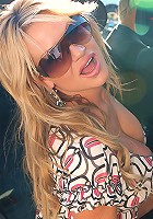 Kelly and Audrey Bitoni lick each others pussy in the backseat of the car.