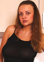 Katya stipping off to reveal her large udders and shaved cunt