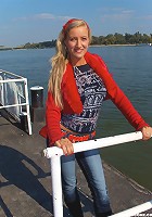 Sweet awesome blondie with big natural mammaries strips at the beach