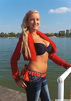 Sweet awesome blondie with big natural mammaries strips at the beach