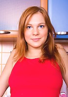Redhead teen shows her great tits