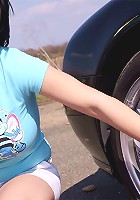Busty teen washes her car and soaps up her massive tits